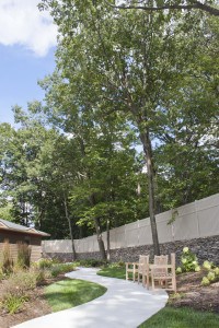 A beautiful walkway in the outdoor recreation and relaxation area at The Pines Senior Living