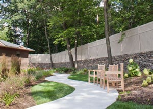 A winding path and walkway in the outside relaxation and recreation area of The Pines Senior Living